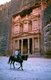Jordan: An Arab horseman in front of Al Khazneh (The Treasury), Petra