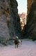 Jordan: Arab horseman in the Siq (shaft) leading to the ancient city of Petra