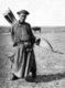 China / Inner Mongolia: A traditional Mongol archer in the Inner Mongolian grasslands, c. 1940. Front view